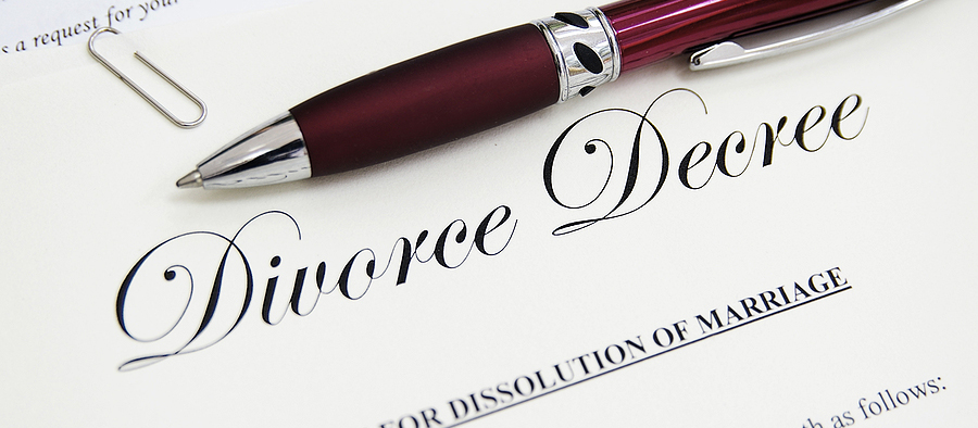 legal divorce paper documents with pen closeup