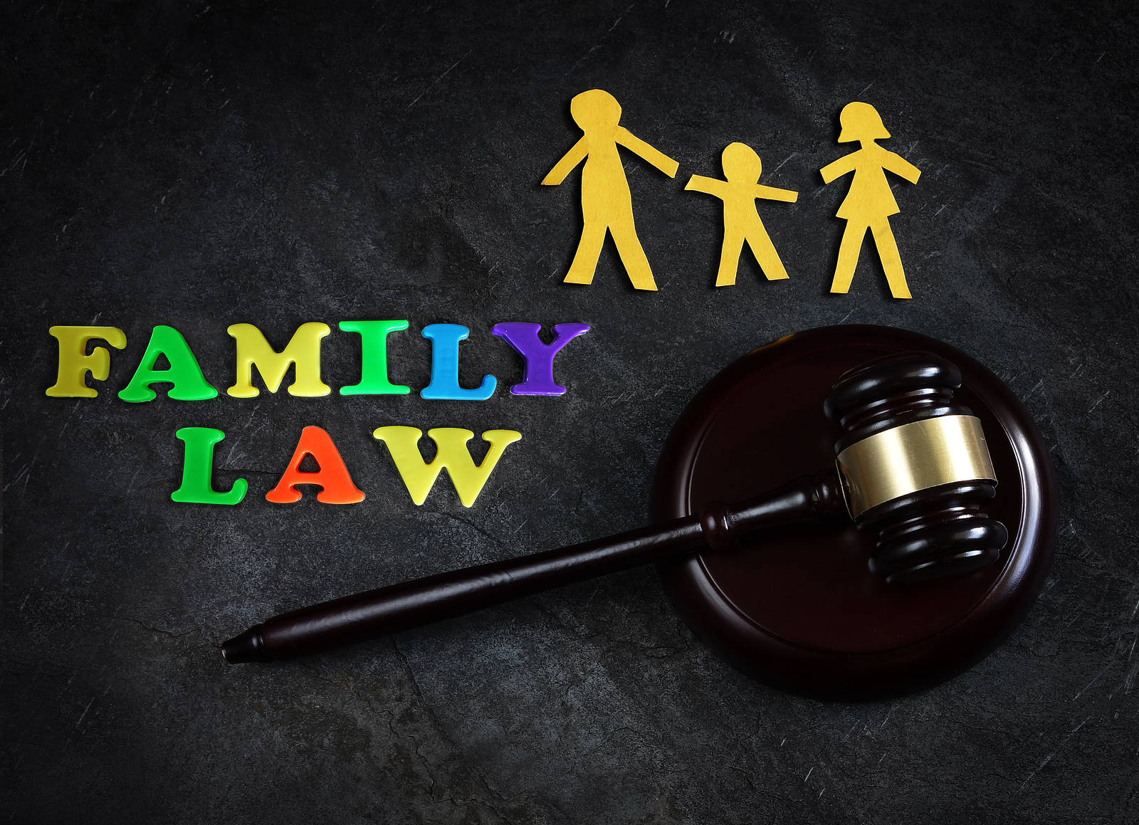Paper family of three with legal gavel and Family Law letters